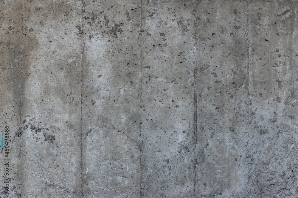 Reinforced concrete texture. Surface of old and dirty reinforced concrete with traces of wooden formwork.