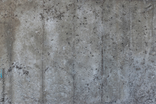 Reinforced concrete texture. Surface of old and dirty reinforced concrete with traces of wooden formwork.