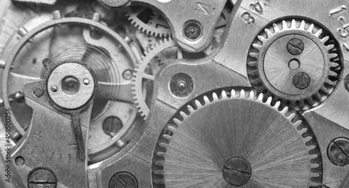 Gears in a watch mechanism. Black and white photography