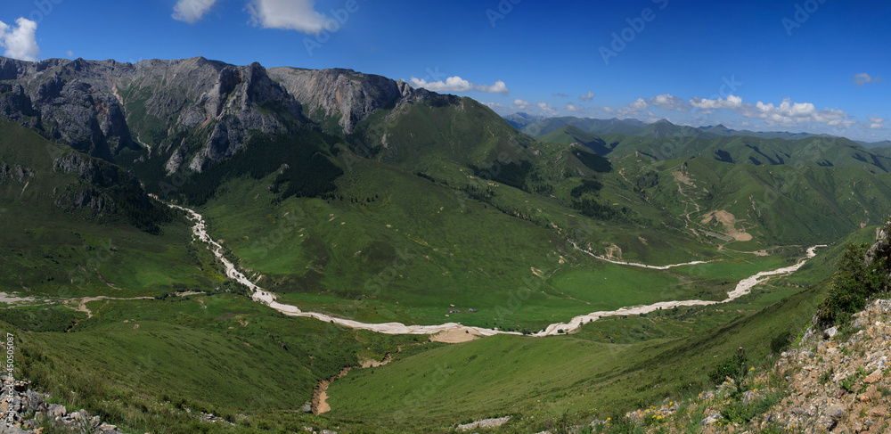 Panorama view of  high altitude grassland mountain landscape