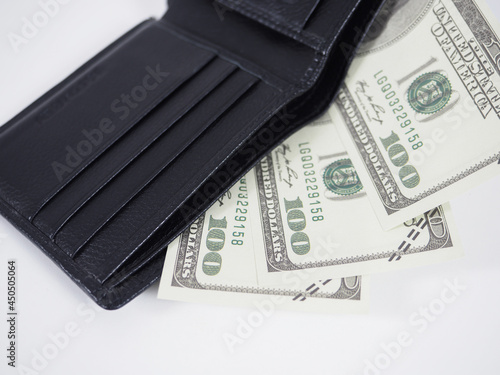 Closeup money dollar out of wallet white background