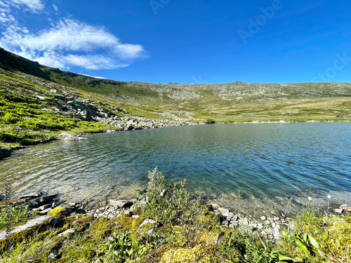 Lake Lunt-Husap-Tur ("Goose Nest Lake") at the foot of Mount Otorten in sunny weather. Russia, Northern Urals