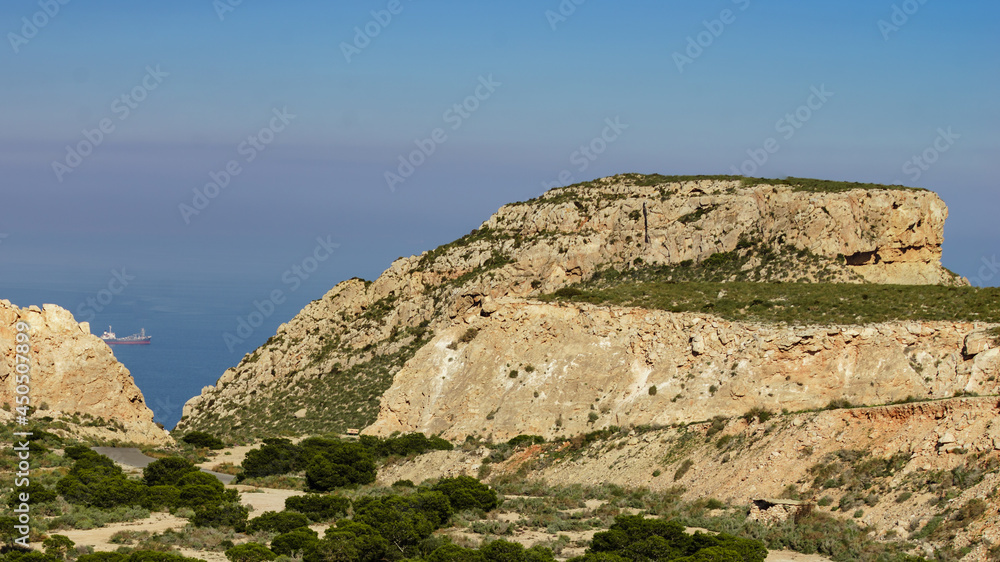 Rocky coast Landscape with ship on sea, Spain