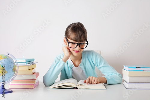 pretty schoolgirl with books. elementary education concept. primary school