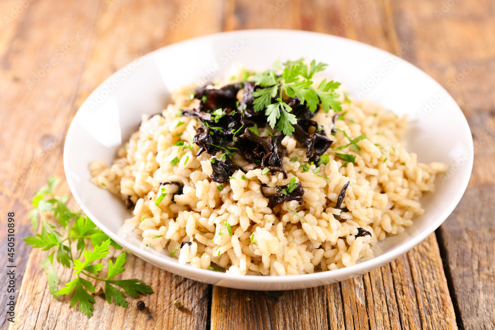 bowl of mushroom risotto and parsley bowl of mushroom risotto and parsley