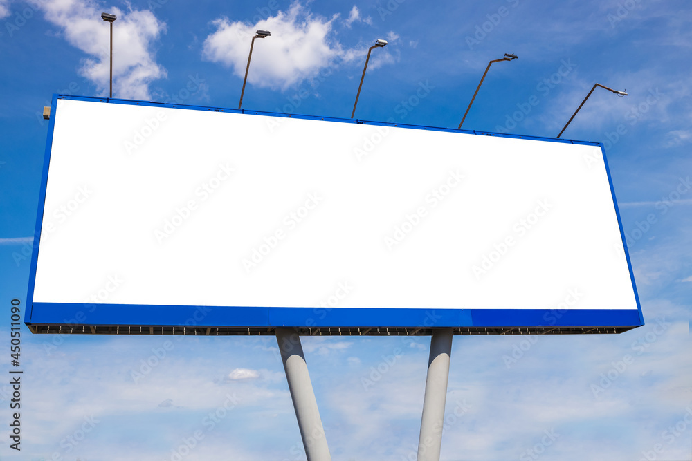 An empty billboard against a blue cloudy sky, mockup An empty billboard against a blue cloudy sky, mockup