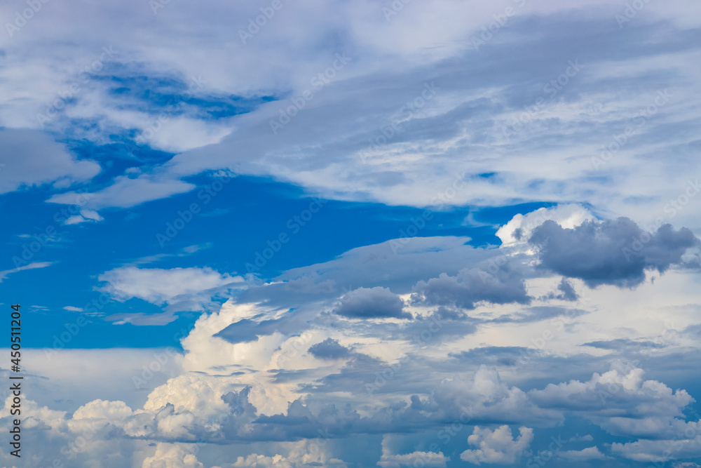 Fototapeta premium cloudy sky with dark thunderclouds approaching in the distance