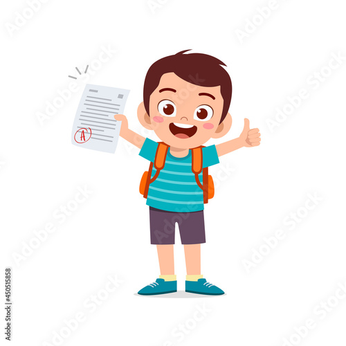 cute little boy feel happy because get good grade from exam