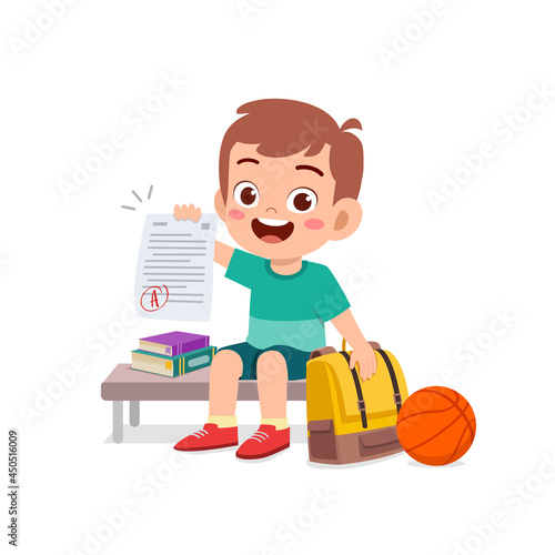 cute little boy feel happy because get good grade from exam