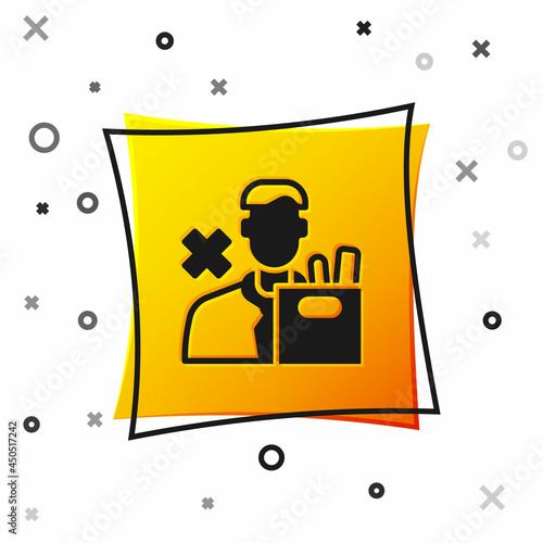 Black Dismissed sad young man carrying box with his personal belonging leaving his job icon isolated on white background. Employee fired from work. Yellow square button. Vector