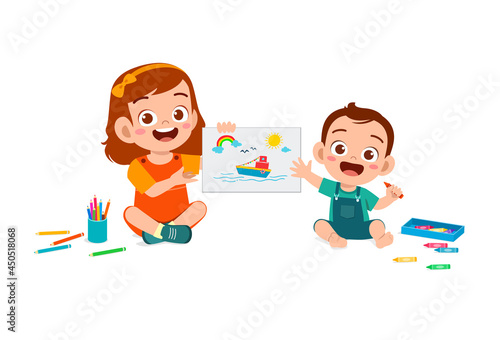 cute little girl drawing together with baby sibling