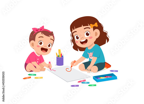 cute little girl drawing together with baby sibling
