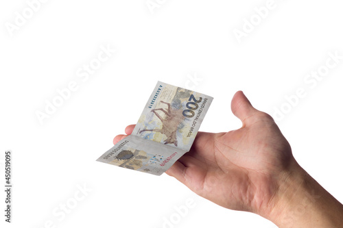 man holding 200 reais bills isolated on white. Brazilian money. paying