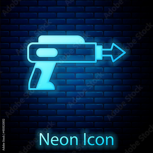 Glowing neon Fishing harpoon icon isolated on brick wall background. Fishery manufacturers for catching fish under water. Diving underwater equipment. Vector