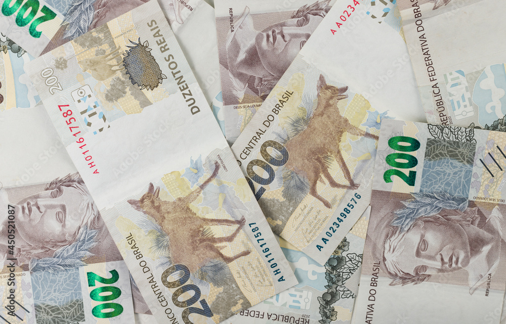 Obraz premium 200 reais bills background pattern. Brazilian bank notes