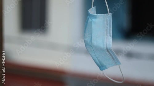 Protective mask hanging on the clothesline photo