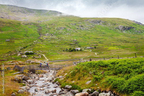 Walk from Gwern gof Ichaf to LLyn Ogwen, with two cyclists on the bridge