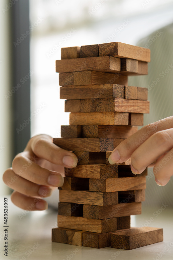 Hands of businessmen build towers and protect them to stop risk and safety. Investment and insurance related to real estate and property Hands of businessmen build towers and protect them to stop risk and safety. Investment and insurance related to real estate and property
