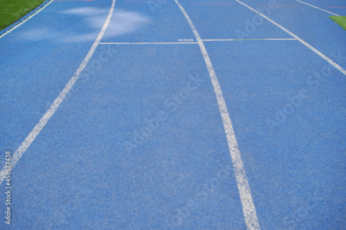 Athletic blue stadium tracks. © vitleo
