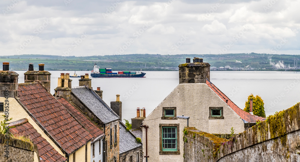 A view across the roof tops towards the Firth of Forth at Culross, Scotland on a summers day
