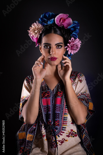 Beautiful Woman wearing a traditional pice of Mexican fabric photo