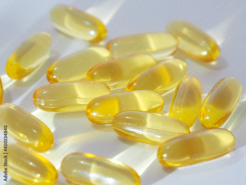 Omega-3 cod liver oil in a white container and with a white background picture. Omega-3 cod liver oil in a white container and with a white background picture.
