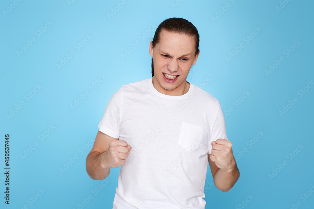 young guy in t-shirt standing with boxing gesture young guy in t-shirt standing with boxing gesture