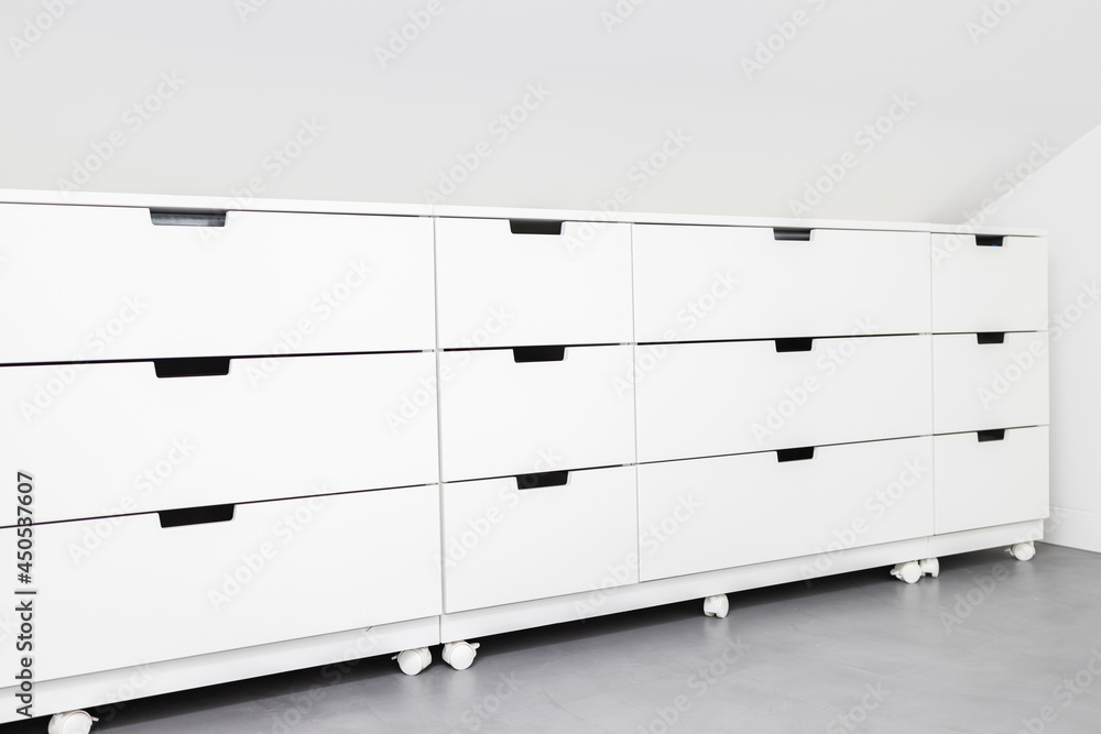 Modern Drawer cabinet with plenty of storage space in a room of a house. Copy space Modern Drawer cabinet with plenty of storage space in a room of a house. Copy space