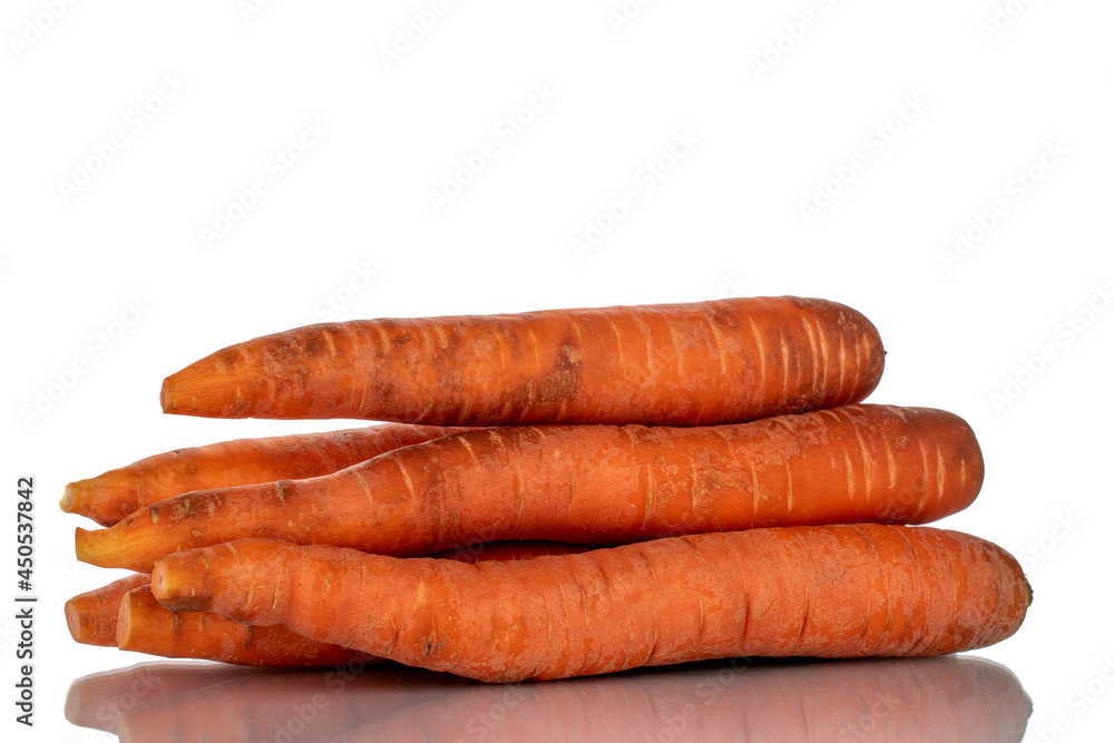 Several unpeeled organic carrots, close-up, isolated on white. Several unpeeled organic carrots, close-up, isolated on white.