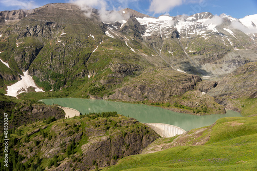 Dam of the Margaritze Reservoir underneath the Grossglockner Mountain. Austria. Europe photo