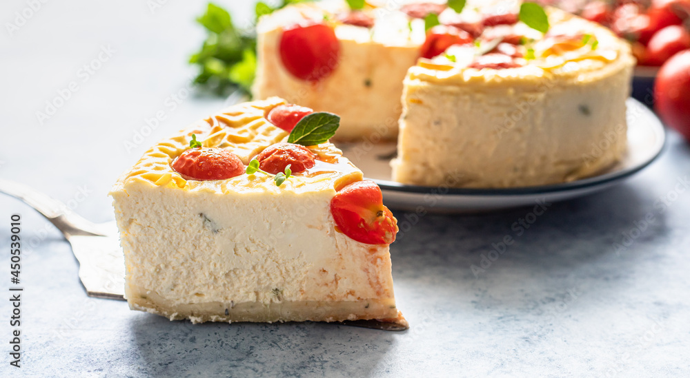 Piece of savoury tomato cheesecake with herbs decorated mint, blue concrete background. Piece of savoury tomato cheesecake with herbs decorated mint, blue concrete background.