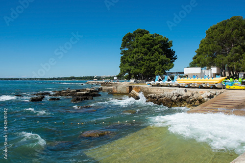 The summer coast just north of the historic centre of Porec on the Istria coast of Croatia 