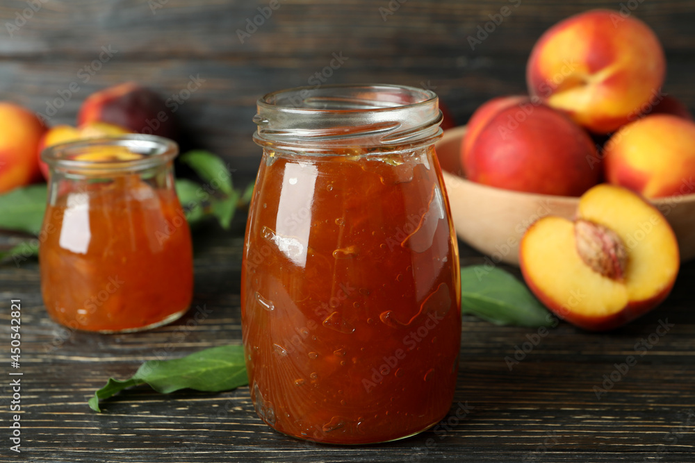 Peach jam and ingredients on rustic wooden table Peach jam and ingredients on rustic wooden table