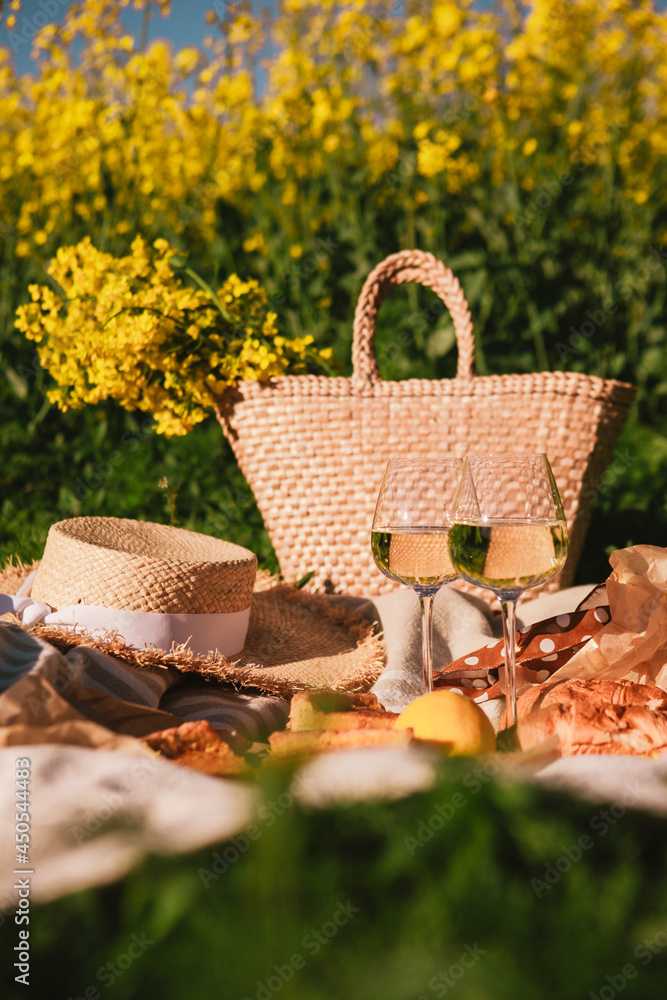 picnic concept glasses of wine bun outdoors on blanket