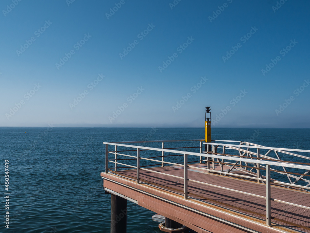 Peaceful and serene scene of the Mediterranean Sea from the pier in Estepona, Costa del Sol