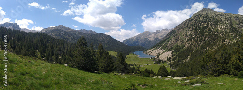 Landscape in the National Park of Aigüestortes. View of the Lake Llong and the valley. Spain.