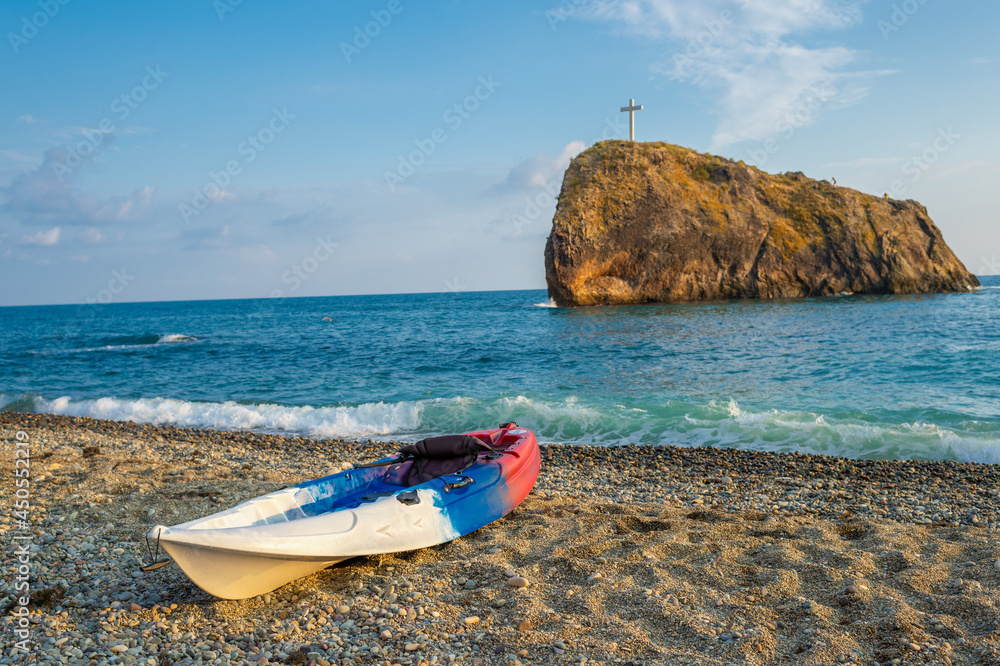 Boat on a pebble beach with sea views in the area of Cape Fiolent Boat on a pebble beach with sea views in the area of Cape Fiolent