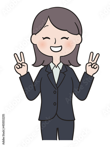 笑顔でダブルピースをするスーツ姿の女性