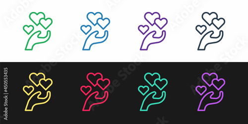 Set line Heart in hand icon isolated on black and white background. Hand giving love symbol. Valentines day symbol. Vector