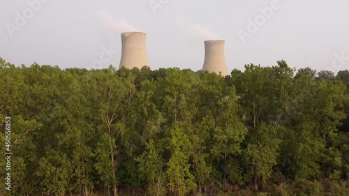 Distant View Of The Chimney Structures Of Enrico Fermi II Nuclear Power Plant In Newport, Michigan. ascending drone shot photo