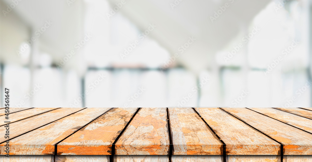 Wooden board empty table in front of blurred background. Perspective brown wood over blur in coffee shop - can be used for display or montage your products.Mock up for display of product Wooden board empty table in front of blurred background. Perspective brown wood over blur in coffee shop - can be used for display or montage your products.Mock up for display of product