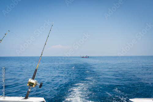 Seascape,Fishing reels and rods reels.Outdoor adventure travel to beautiful Hawaii beach.