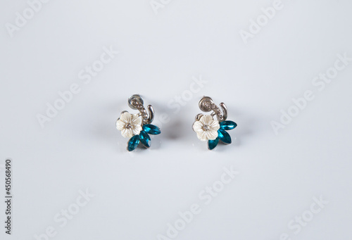 Earrings isolated on white background. Concept of fashion.