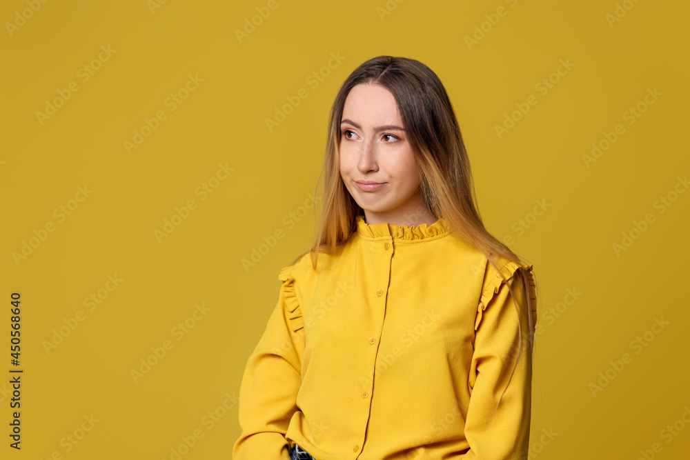 unsatisfied woman on yellow background. Human emotions unsatisfied woman on yellow background. Human emotions