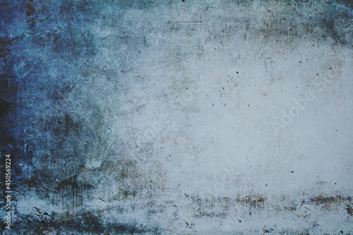 old white wall covered with dirty plaster with a visible structure