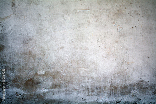 old white wall covered with dirty plaster with a visible structure © Agata