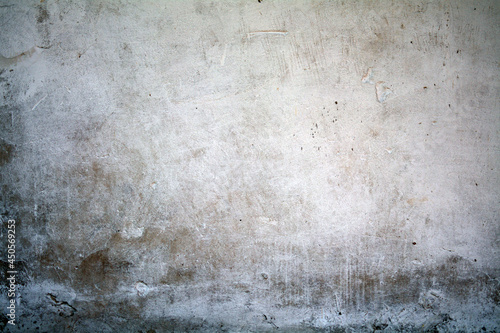 old white wall covered with dirty plaster with a visible structure