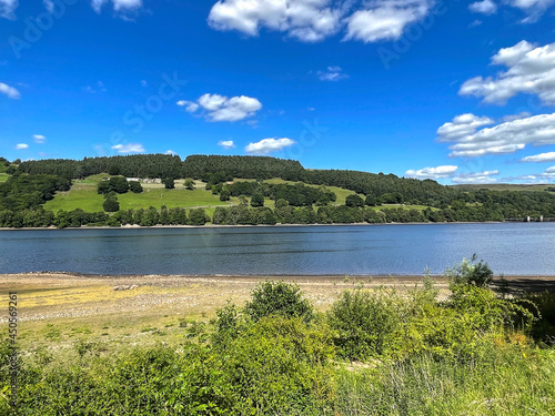 View across, Gouthwaite Reservoir, with hills in the distance, on a hot day near, Pateley Bridge, UK