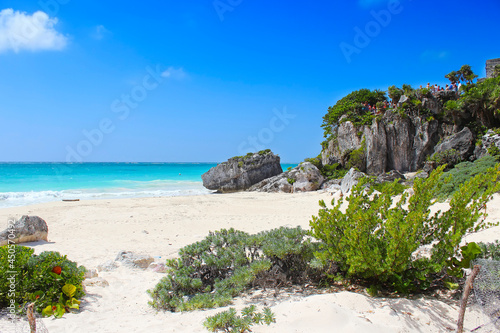 Tropical beach in Tulum, Caribbean sea. Tulum is the site of a pre-Columbian Mayan walled city on Caribbean coastline in Riviera Maya, Quintana Roo, Yucatan, Mexico.