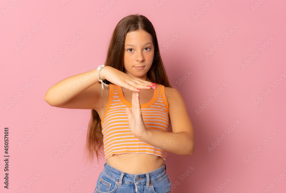 Young caucasian woman isolated showing a timeout gesture. Young caucasian woman isolated showing a timeout gesture.